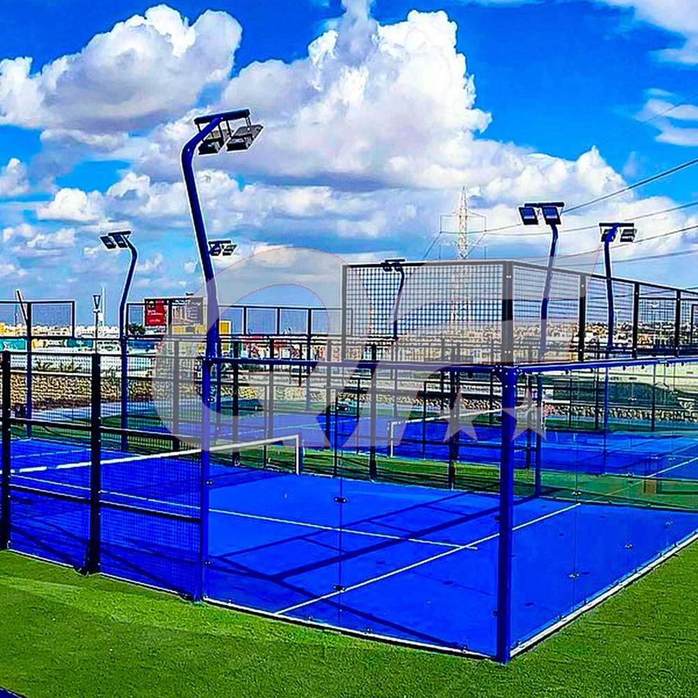 outdoor padel court with glass walls, metal fencing.