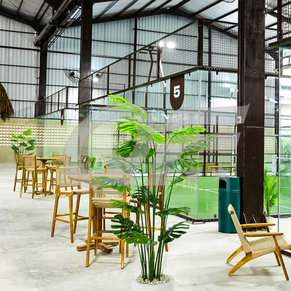 indoor panoramic padel court with lounge area